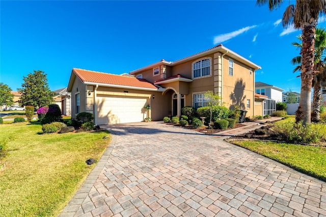 view of front facade with a front yard and a garage