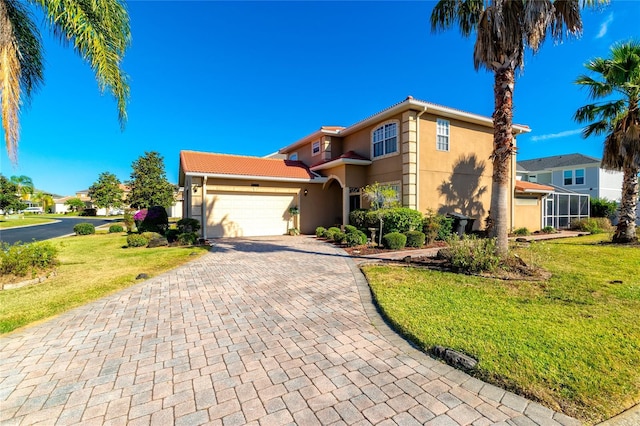 view of front of property featuring a garage and a front lawn