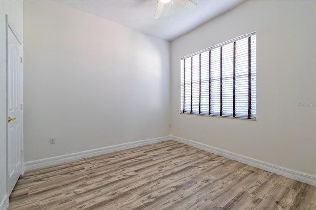 unfurnished room featuring light hardwood / wood-style floors and ceiling fan