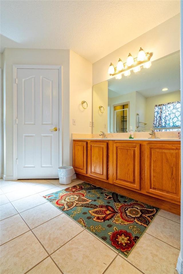 bathroom featuring tile patterned floors and vanity