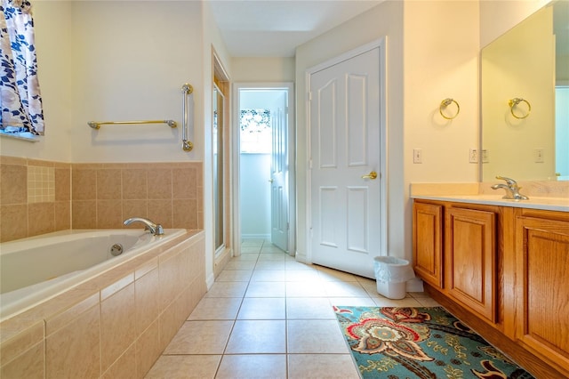 bathroom featuring tile patterned flooring, vanity, and independent shower and bath