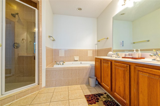 bathroom featuring tile patterned flooring, vanity, and independent shower and bath