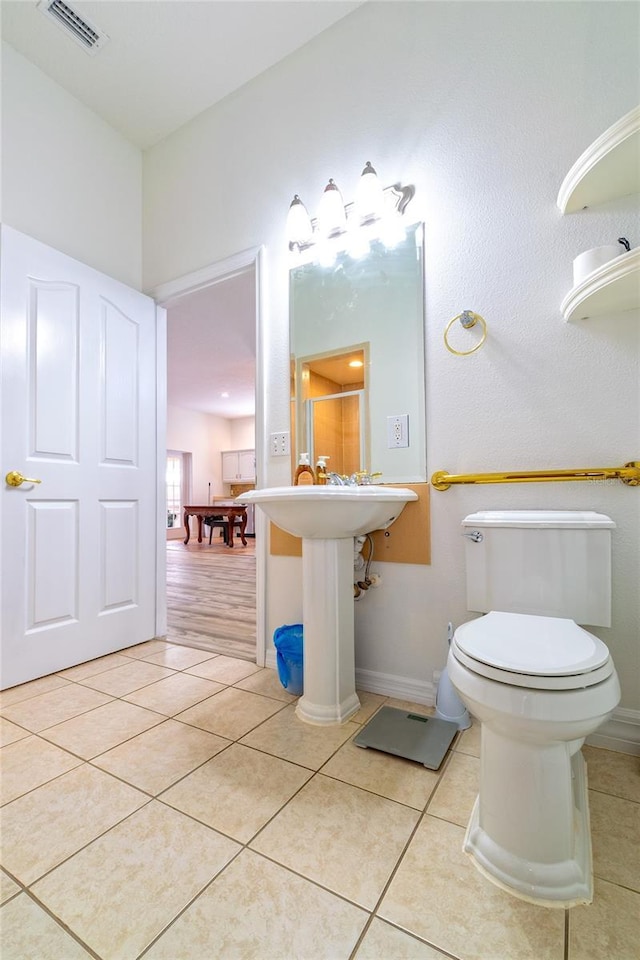 bathroom with tile patterned flooring and toilet