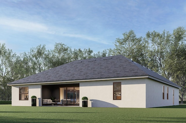 rear view of house featuring a yard and an outdoor hangout area