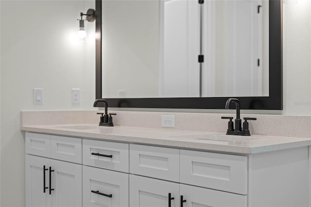 full bathroom featuring a sink and double vanity