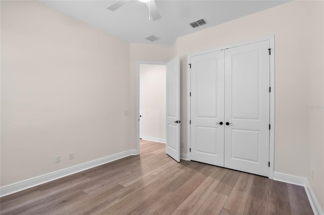 unfurnished bedroom featuring visible vents, baseboards, and light wood-type flooring