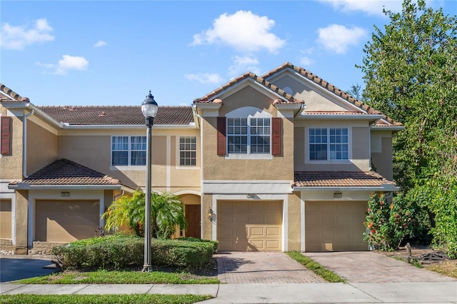 mediterranean / spanish-style home featuring a garage