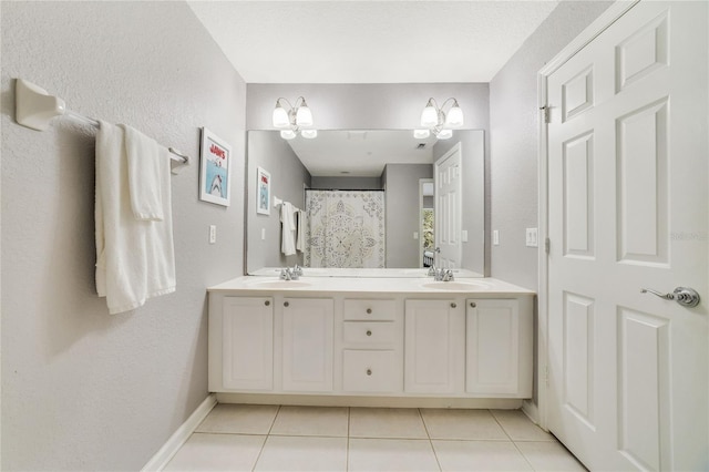 bathroom with tile patterned flooring and vanity