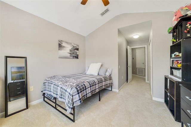 bedroom featuring light colored carpet, vaulted ceiling, and ceiling fan