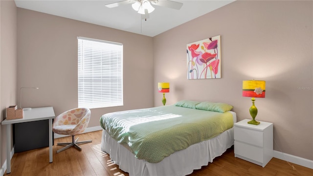 bedroom featuring hardwood / wood-style floors and ceiling fan