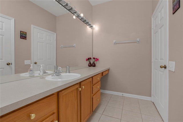 bathroom with tile patterned floors and vanity