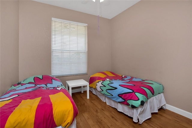 bedroom featuring hardwood / wood-style floors and ceiling fan