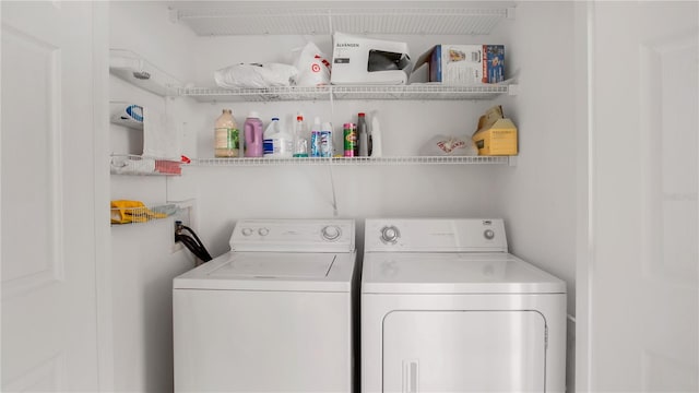 clothes washing area featuring washing machine and clothes dryer