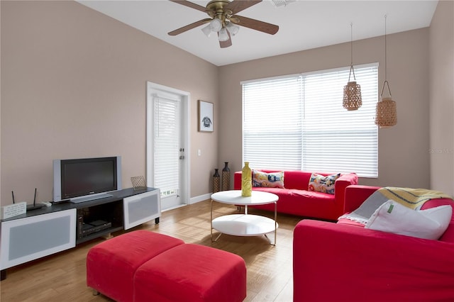 living room with ceiling fan and hardwood / wood-style floors