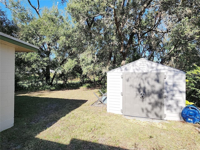 view of outdoor structure with a lawn