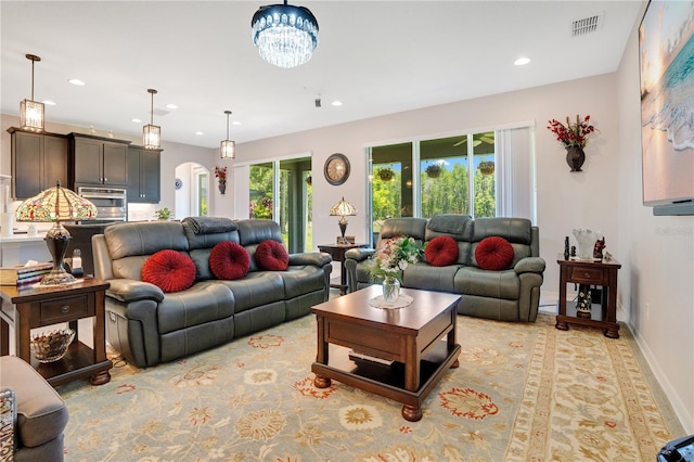 living room with an inviting chandelier