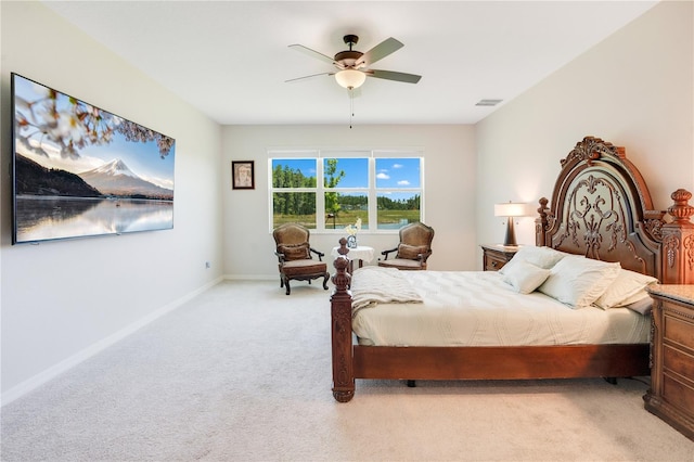 bedroom featuring light colored carpet and ceiling fan