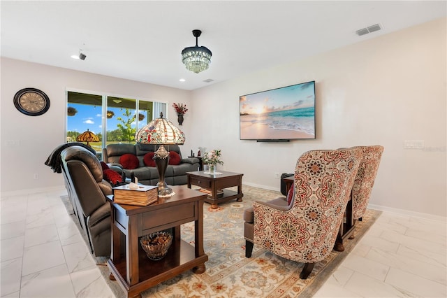 living room featuring a notable chandelier