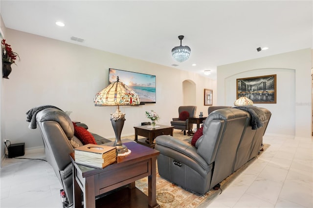 living room featuring a notable chandelier