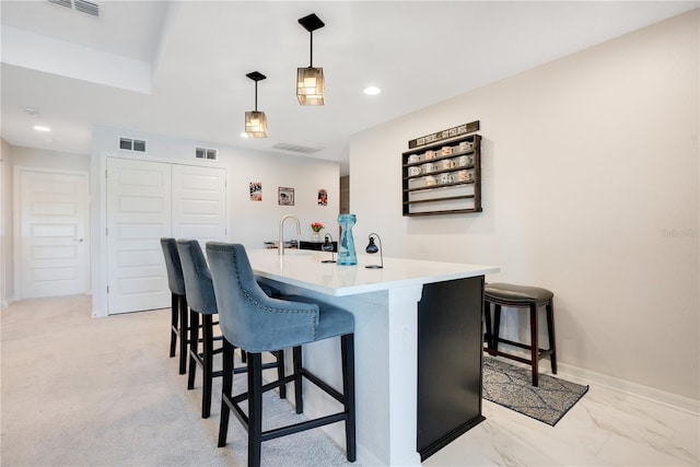 bar featuring light colored carpet and pendant lighting