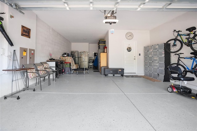 garage featuring stainless steel fridge, electric panel, and a garage door opener