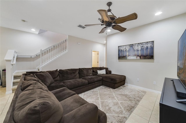 living room featuring ceiling fan and light tile patterned flooring