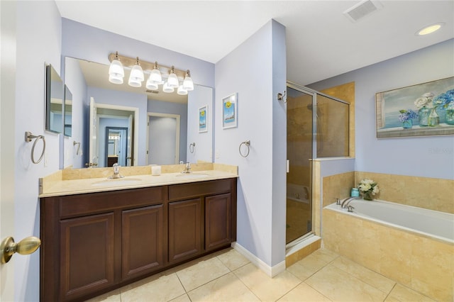 bathroom with tile patterned flooring, vanity, and independent shower and bath