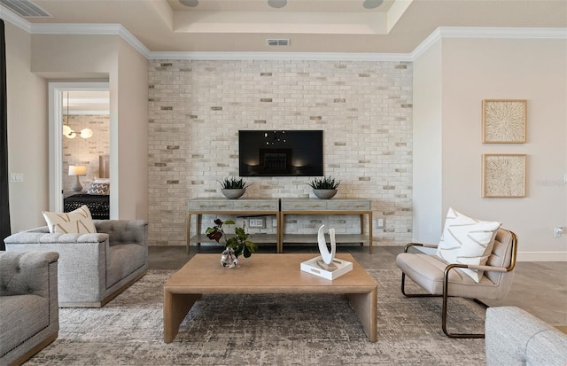 living room featuring crown molding and a tray ceiling