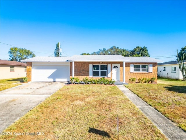 ranch-style home with a garage and a front lawn