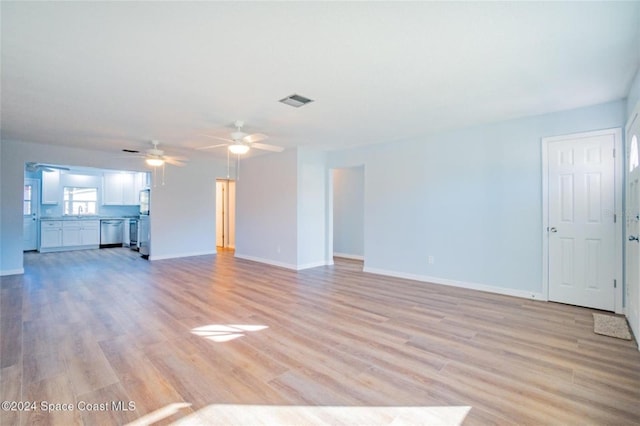 unfurnished living room featuring light hardwood / wood-style flooring and ceiling fan