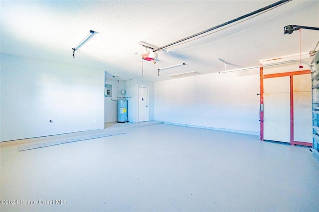 garage with electric panel, gas water heater, and a garage door opener