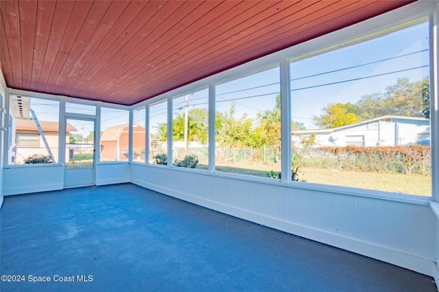 unfurnished sunroom featuring wooden ceiling