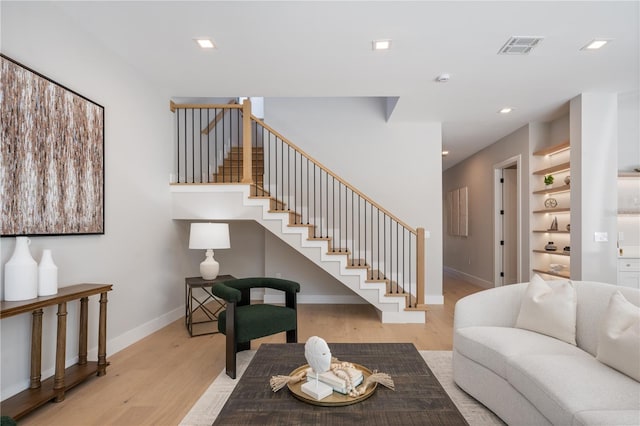 living room with light hardwood / wood-style flooring