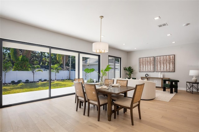 dining space featuring light hardwood / wood-style flooring