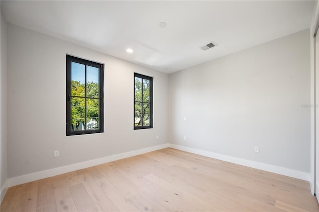 unfurnished room featuring light hardwood / wood-style floors