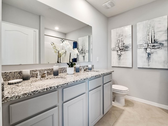 bathroom featuring tile patterned floors, vanity, curtained shower, and toilet