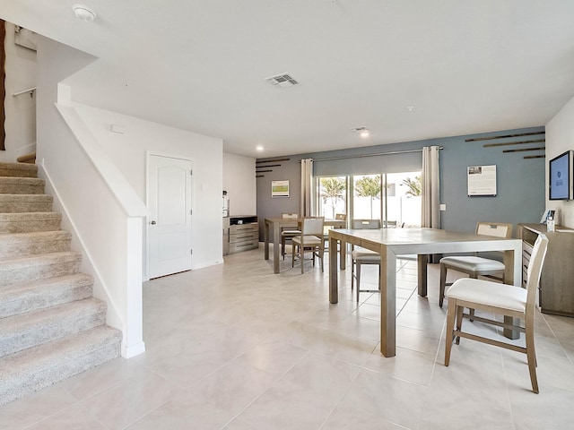 dining space featuring light tile patterned floors