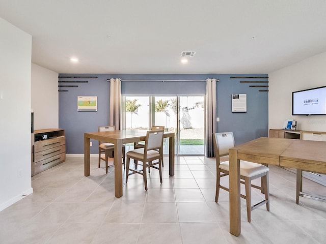 dining space featuring light tile patterned floors