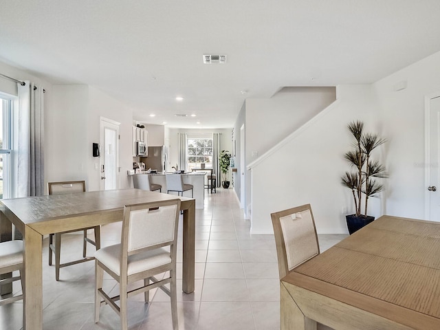 dining room with light tile patterned flooring