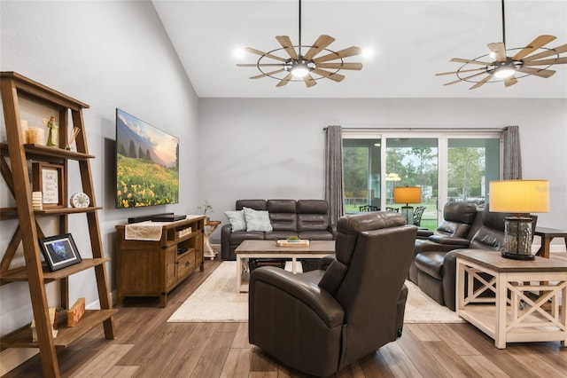 living room with hardwood / wood-style floors and lofted ceiling