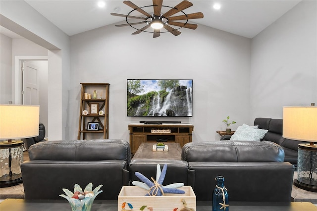 living room featuring ceiling fan and vaulted ceiling