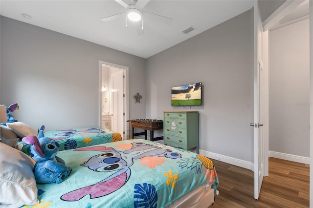 bedroom featuring wood-type flooring, connected bathroom, and ceiling fan