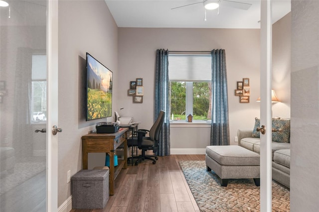 office area with ceiling fan, wood-type flooring, and french doors