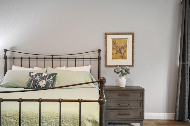 bedroom featuring hardwood / wood-style floors