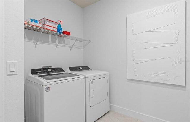 washroom with washer and clothes dryer