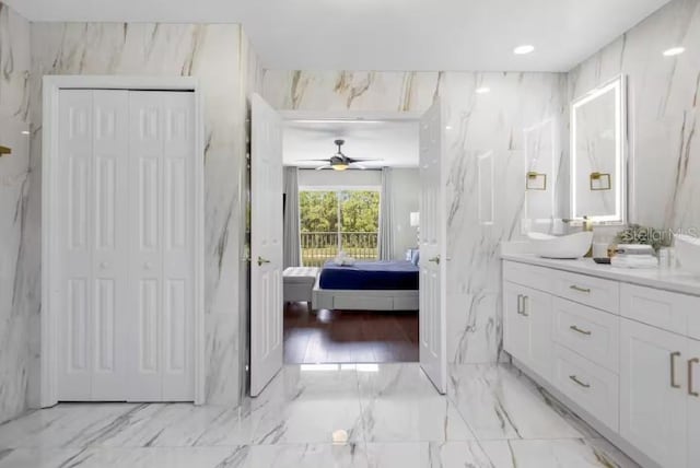 2912 Sunset Lakes Blvd, Kissimmee, FL 34747 - full bath with connected bathroom, vanity, a closet, marble tiled floors, and ceiling fan