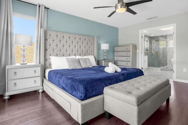 bedroom featuring ensuite bath, ceiling fan, and dark wood-type flooring