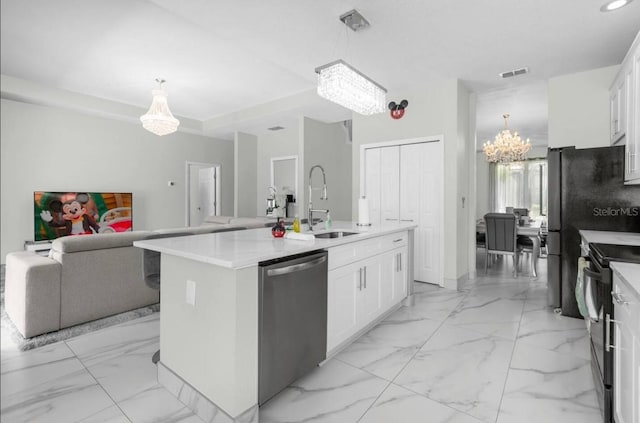 kitchen featuring a chandelier, a center island with sink, white cabinetry, and stainless steel dishwasher