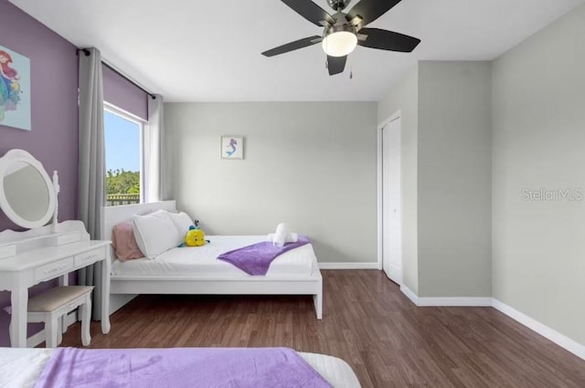 bedroom featuring ceiling fan and dark wood-type flooring