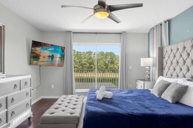 bedroom with access to outside, ceiling fan, and dark wood-type flooring